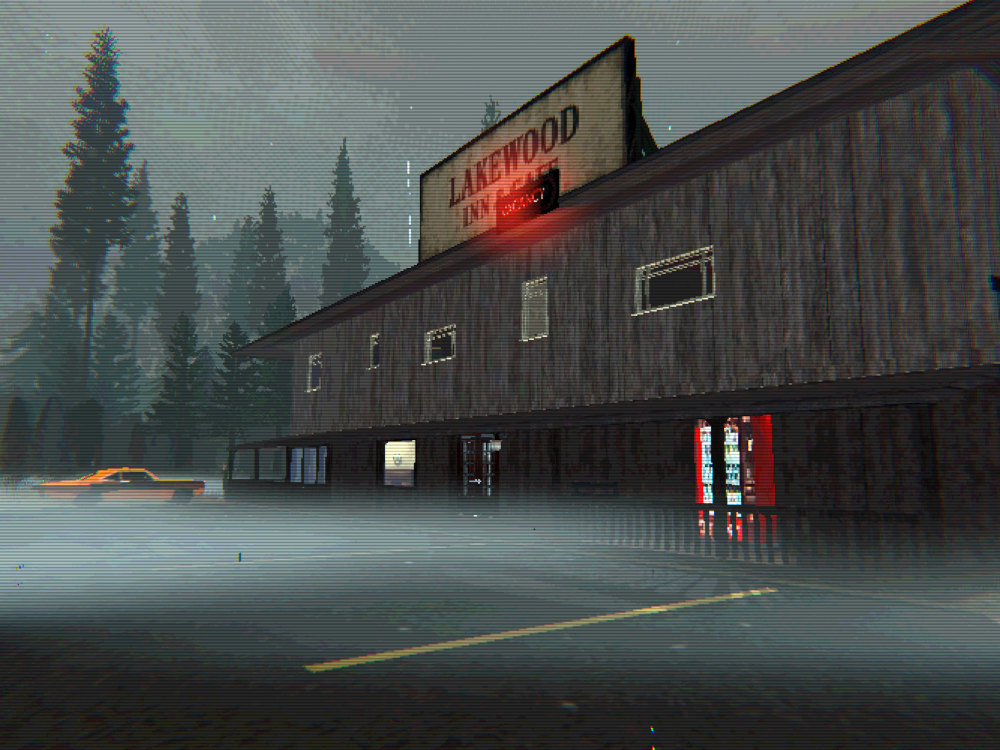 The hotel from the parking lot on a foggy morning: a long clapboard building with a rooftop sign, a red VACANCY neon and an orange car parked in the mist