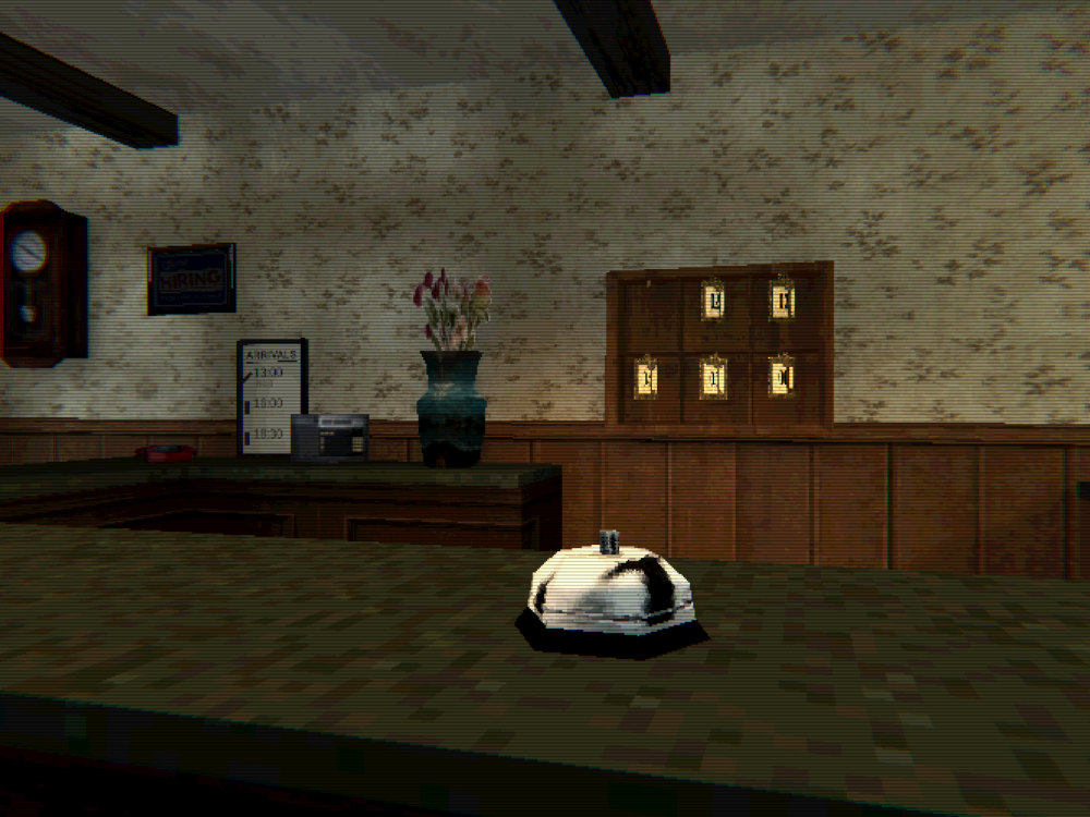 The front desk: the service bell in front, and behind it the key rack, a vase of flowers, the arrivals board and a pendulum clock
